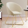 Fauteuil rond en velours beige moderne avec pieds croisés dorés
