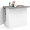 Îlot de cuisine blanc et plateau façon béton