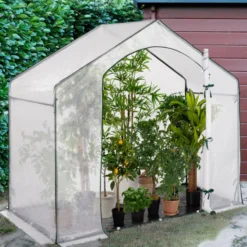 Serre d'hivernage forme de maison pour balcon et terrasse