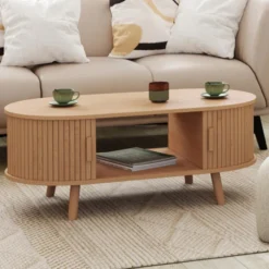 Table basse ovale 100 cm 2 portes coulissantes lattes tasseau bois coloris chêne