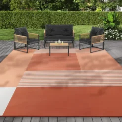 Tapis extérieur terracotta à formes géométriques